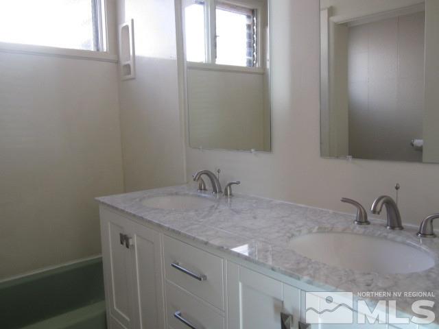 1440 Lander Street Reno, NV 89509 - Photo 9 of 22 a bathroom with a sink and a vanity