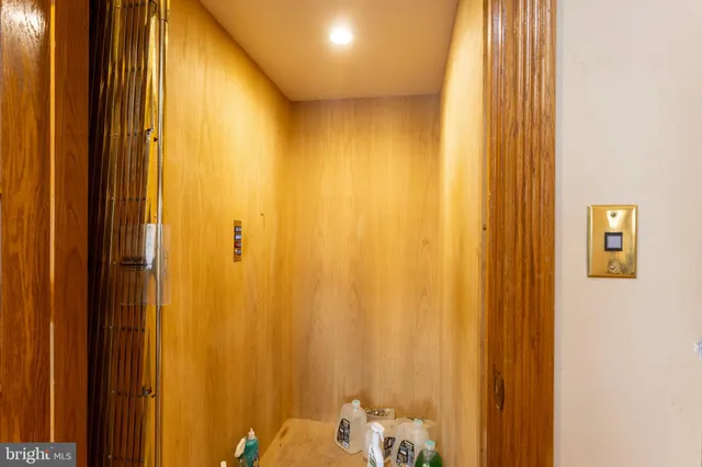 a view of a dining room with furniture a chandelier and wooden floor