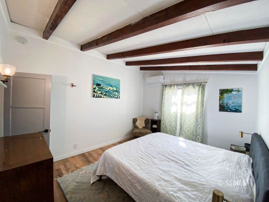 313 North Florence Street Ridgecrest, CA 93555 - Photo 24 of 38 a bedroom with a bed and a window