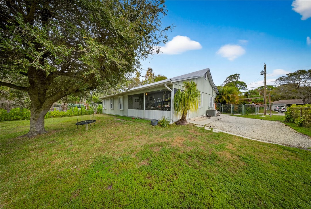 5809 Seagrape Drive Fort Pierce, FL 34982 - Photo 30 of 35 a view of a house with a backyard
