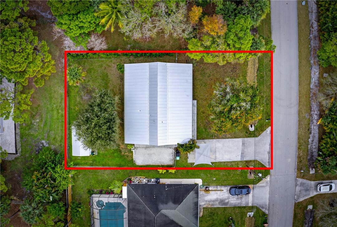 5809 Seagrape Drive Fort Pierce, FL 34982 - Photo 34 of 35 front view of a house with a yard