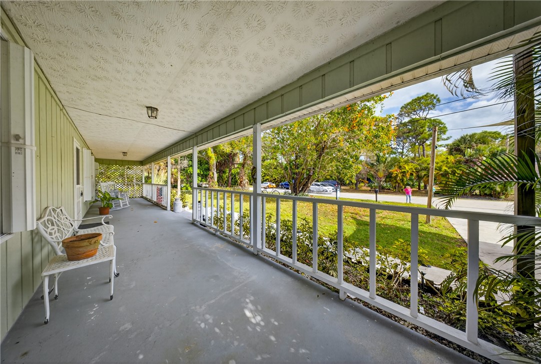 5809 Seagrape Drive Fort Pierce, FL 34982 - Photo 7 of 35 a view of swimming pool with seating area