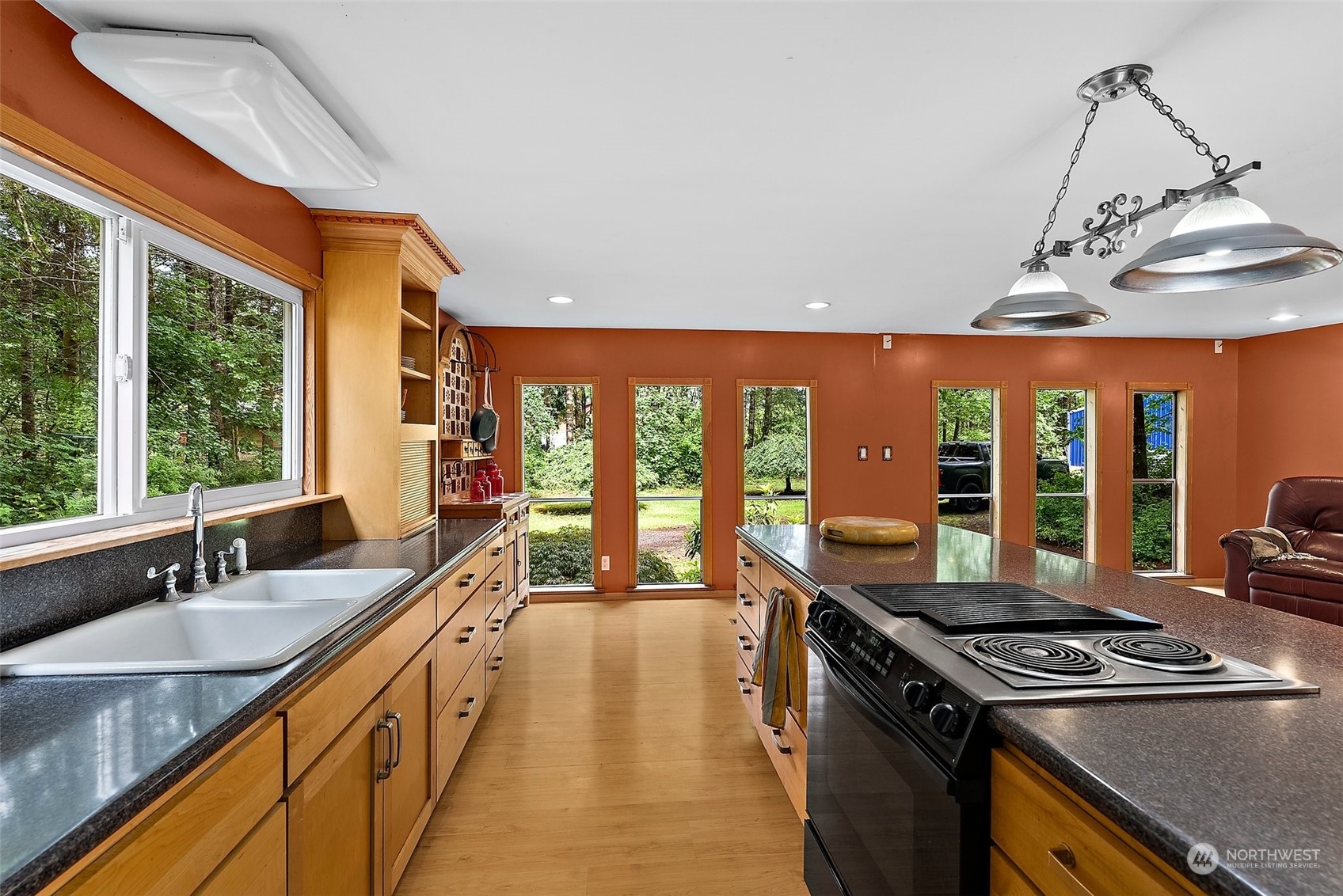 411 Leudinghaus Road Chehalis, WA 98532 - Photo 9 of 25 a kitchen with stainless steel appliances granite countertop a sink a stove and a wooden floors
