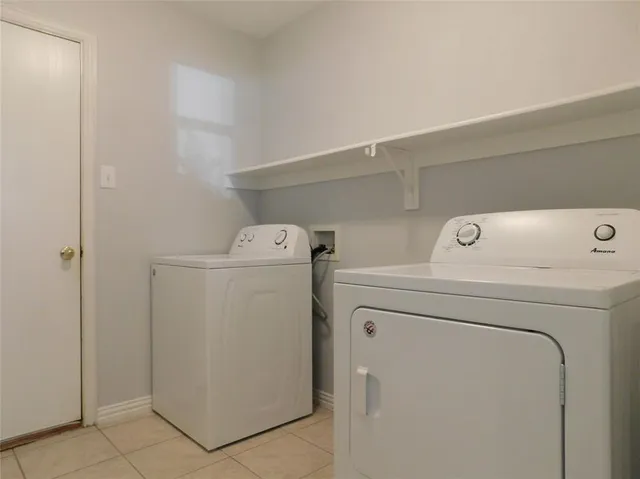 a view of a brick house with a large window