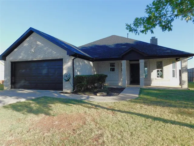 a view of a house with backyard porch and sitting area