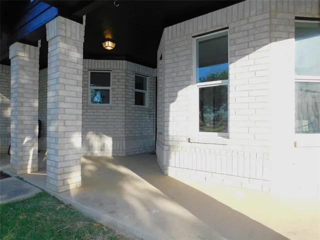 a view of livingroom with hardwood floor and kitchen view