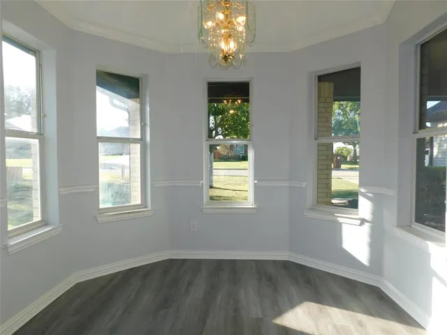 a kitchen with granite countertop a refrigerator and a stove