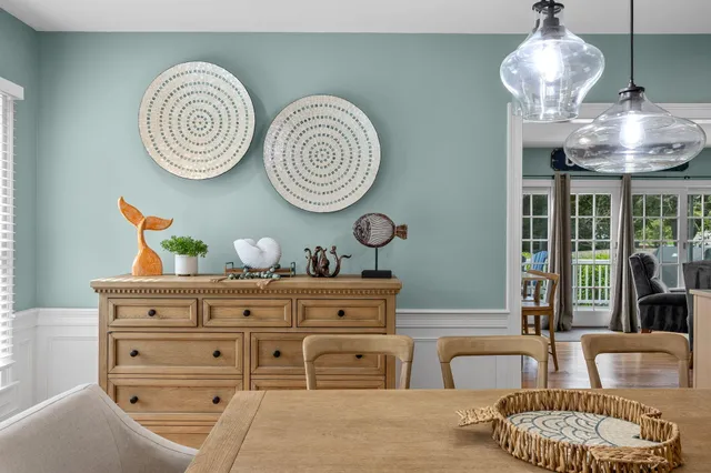 a view of a dining room with furniture and window