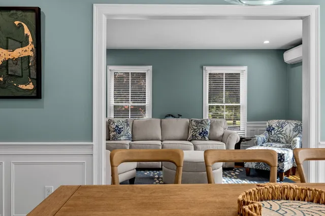 a kitchen with stainless steel appliances granite countertop a sink a stove a refrigerator and cabinets