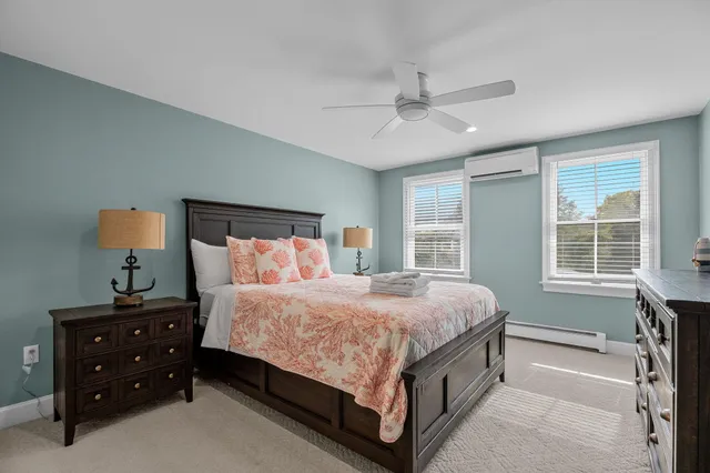 a bathroom with a toilet a sink and a mirror