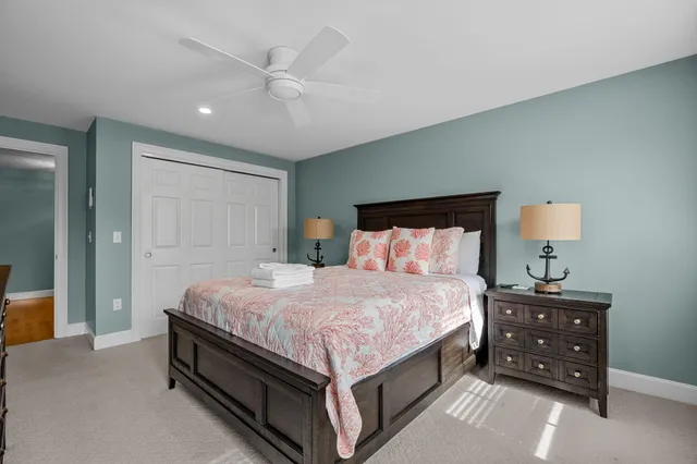 a view of a hallway view with wooden floor and staircase