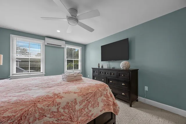 a bathroom with a granite countertop sink mirror and a bathtub