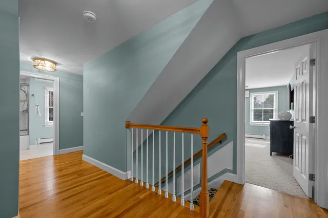 a living room with a flat screen tv and a couch