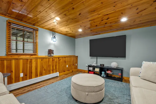 an aerial view of house with yard and lake view