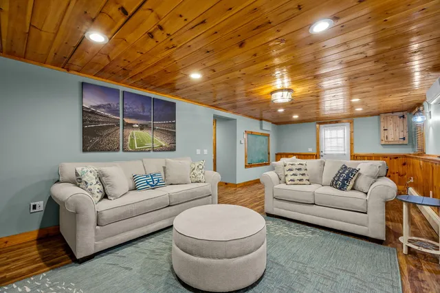 an aerial view of a house with a lake view