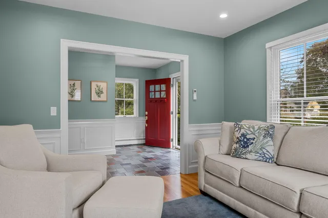 a living room with furniture and a window