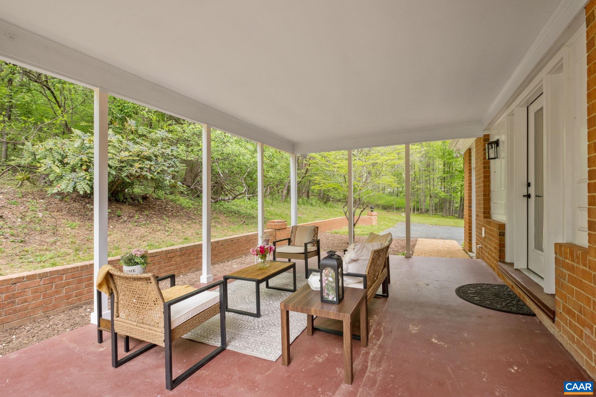 1680 Craigs Store Road Afton, VA 22920 - Photo 28 of 57 a living room with furniture and floor to ceiling windows