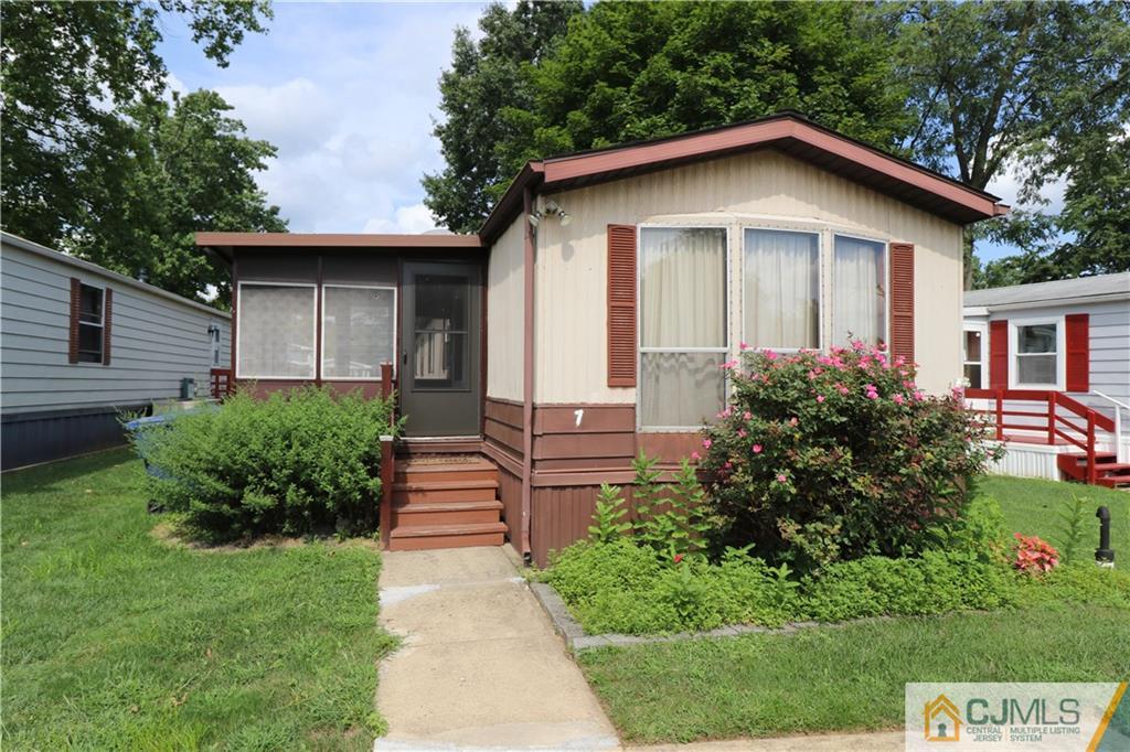 7 Byron Road North Brunswick, NJ 08902 - Photo 1 of 25 a front view of a house with a yard