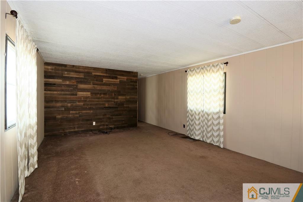 7 Byron Road North Brunswick, NJ 08902 - Photo 7 of 25 a view of an empty room with a window