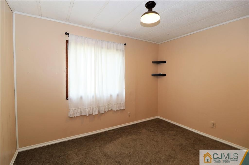 7 Byron Road North Brunswick, NJ 08902 - Photo 9 of 25 an empty room with a window