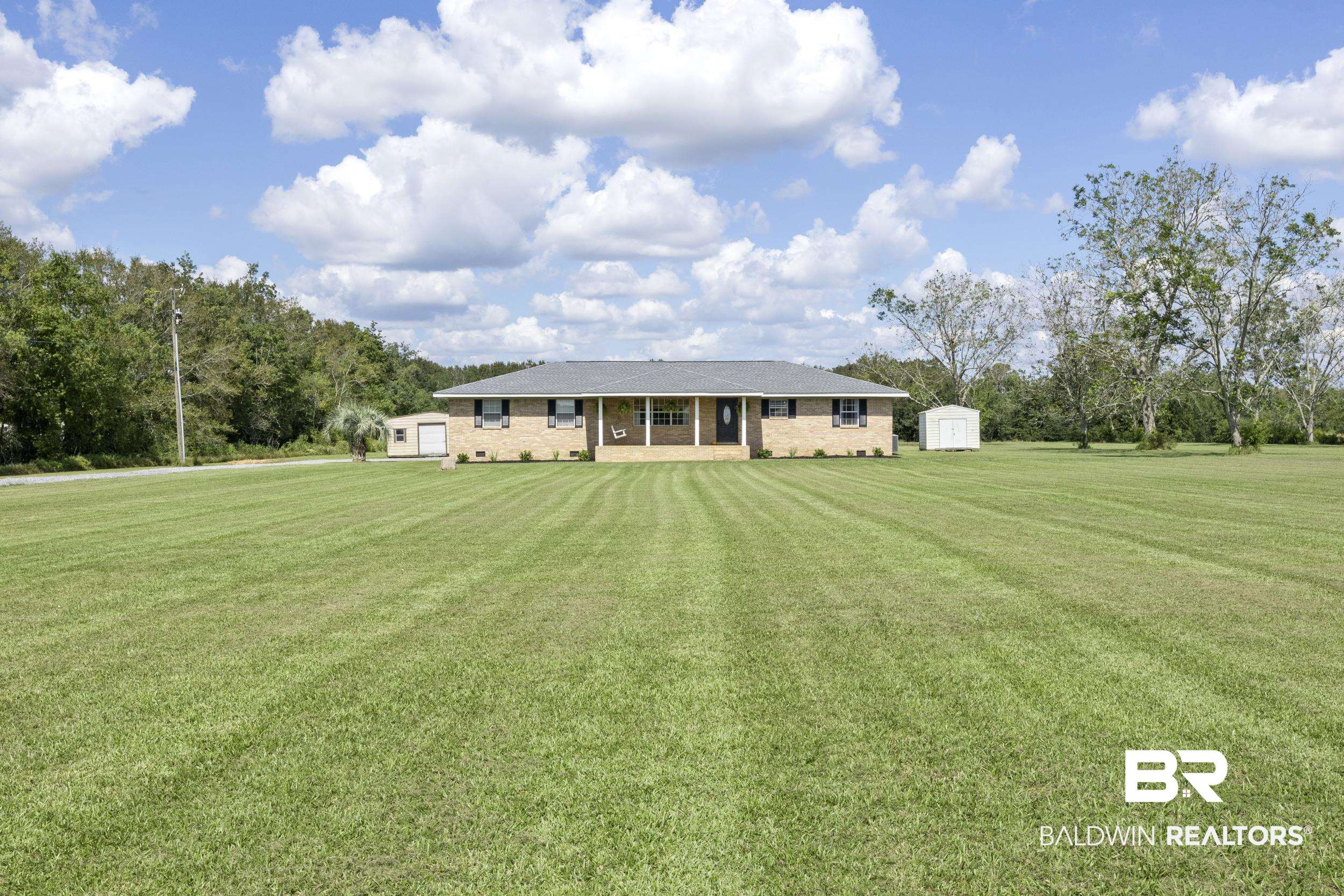 17689 Brewer Road Foley, AL 36535 - Photo 14 of 54 Single story home featuring a storage shed and a front yard