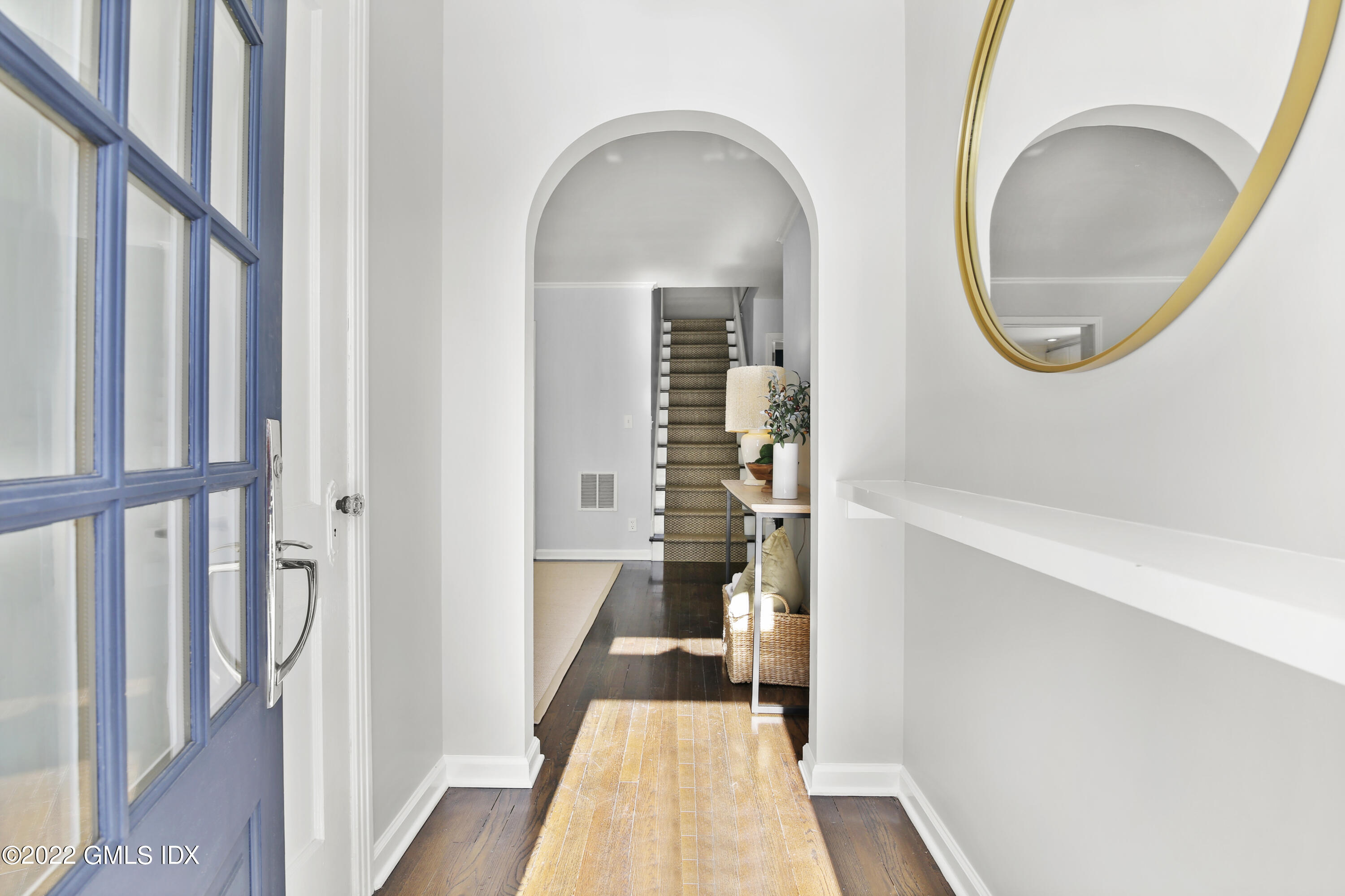 43 Summit Road Riverside, CT 06878 - Photo 2 of 21 a view of a hallway with wooden floor and a dining room