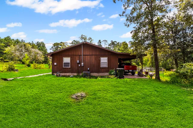 a view of a house with a backyard