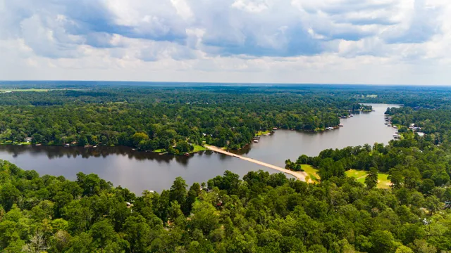 a view of a lake with houses in the back