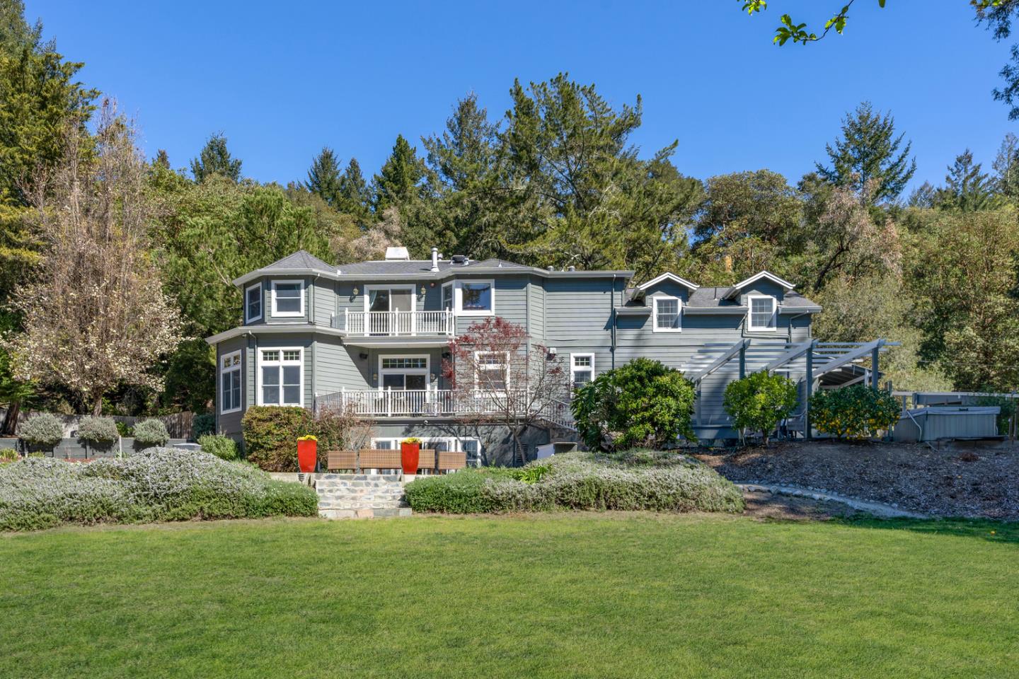 a front view of a house with a garden