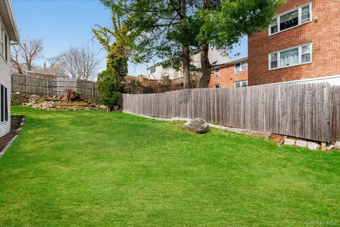 a garden covered with wooden fence