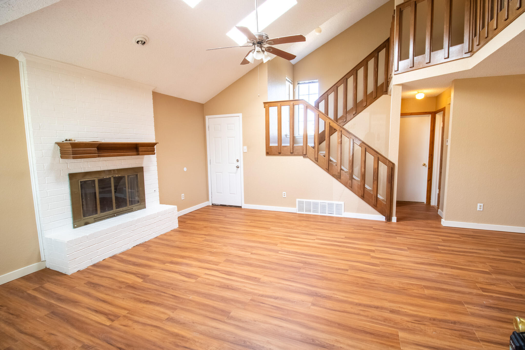 2202 93rd Place Lubbock, TX 79423 - Photo 2 of 11 a view of an empty room with glass door and a window