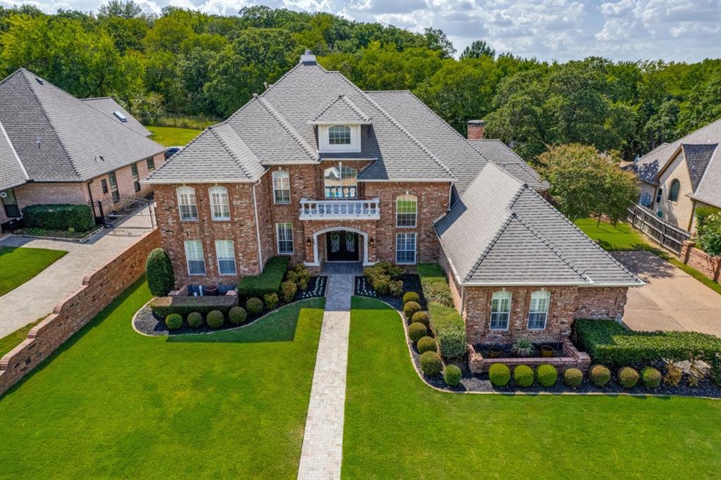 a aerial view of a house with swimming pool garden and patio