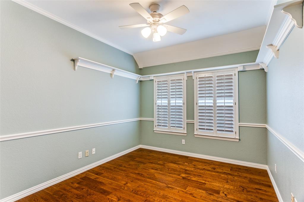 7702 Tillman Hill Road Colleyville, TX 76034 - Photo 20 of 26 a view of an empty room with window and a ceiling fan