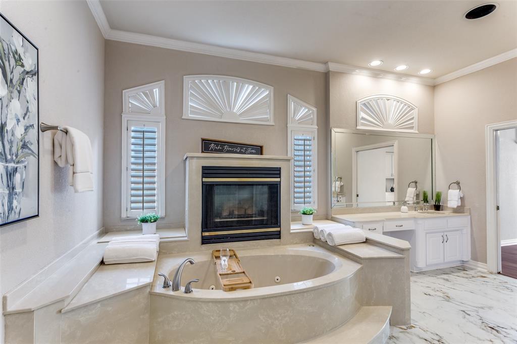 7702 Tillman Hill Road Colleyville, TX 76034 - Photo 23 of 26 a living room with furniture and a fireplace