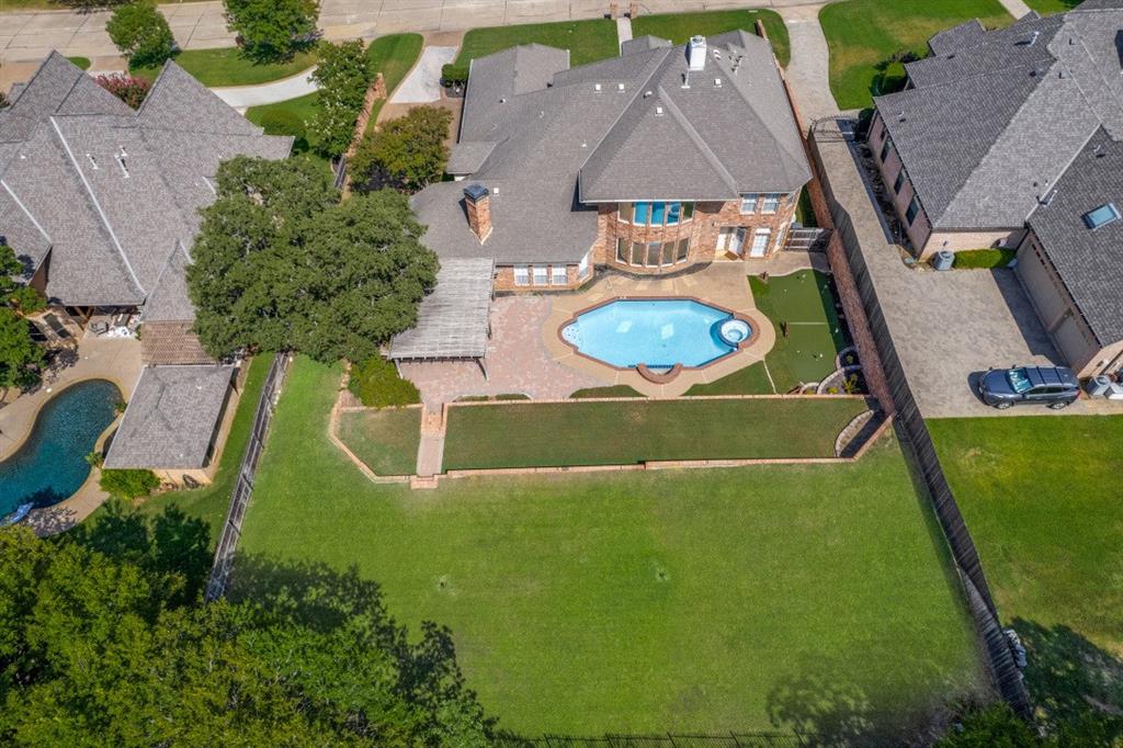7702 Tillman Hill Road Colleyville, TX 76034 - Photo 5 of 26 an aerial view of a house with outdoor space