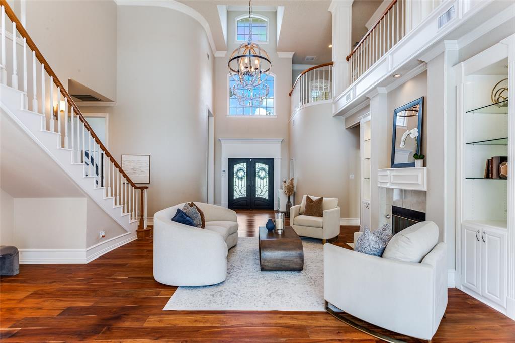 7702 Tillman Hill Road Colleyville, TX 76034 - Photo 6 of 26 a living room with fireplace furniture and a wooden floor