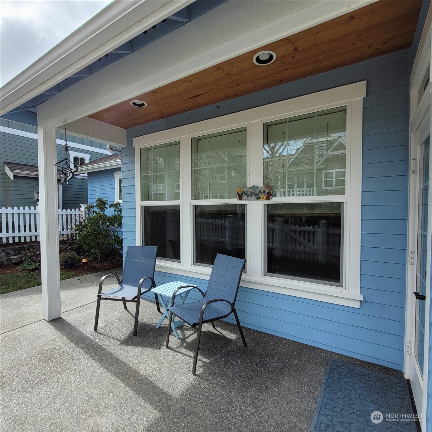 151 Craftsman Court Sequim, WA 98382 - Photo 26 of 40 a living room with a fireplace and a table