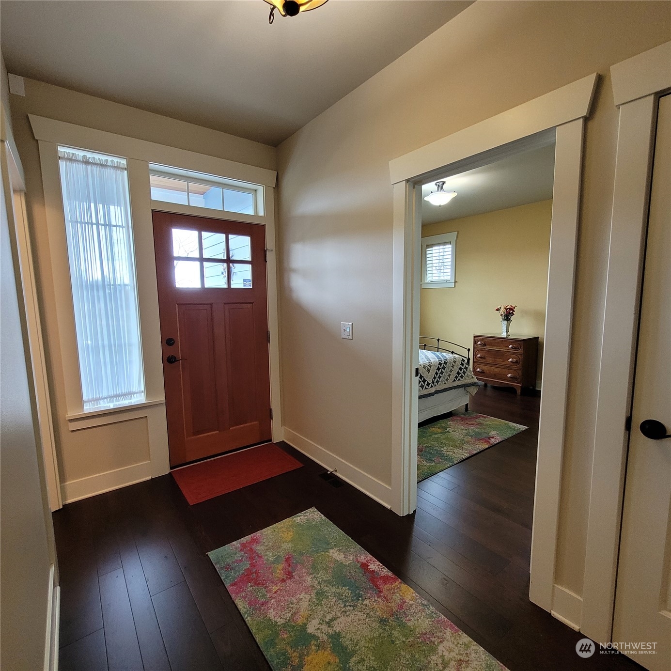 151 Craftsman Court Sequim, WA 98382 - Photo 4 of 40 wooden floor in a hall with wooden floor and a bedroom