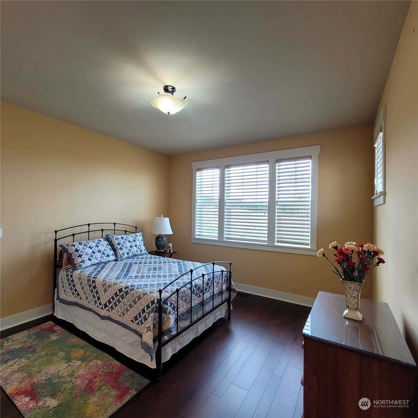 151 Craftsman Court Sequim, WA 98382 - Photo 6 of 40 a bedroom with a bed window and lamp on desk