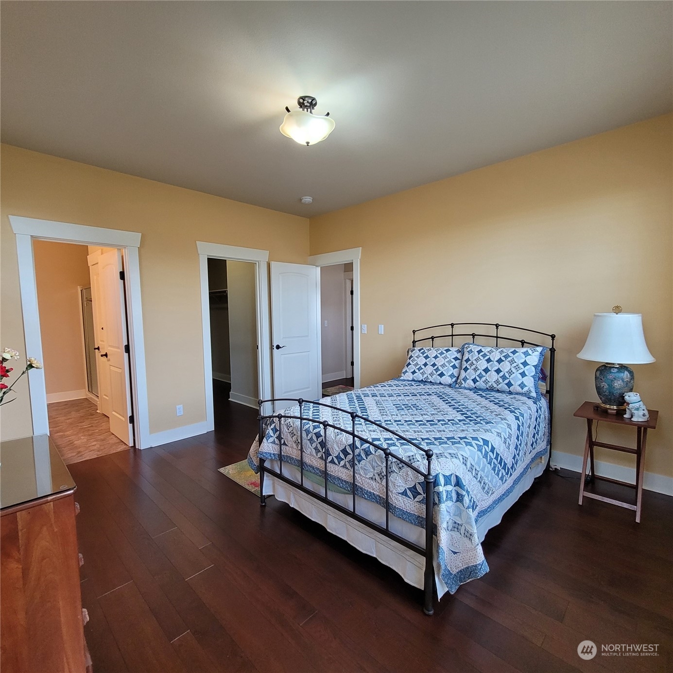 151 Craftsman Court Sequim, WA 98382 - Photo 7 of 40 a bedroom with a bed and a lamp