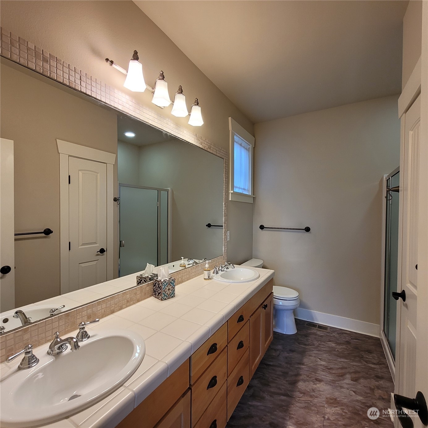 151 Craftsman Court Sequim, WA 98382 - Photo 10 of 40 a bathroom with a double vanity sink mirror and toilet