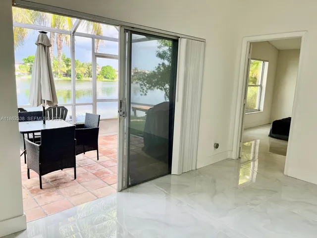 a kitchen with stainless steel appliances a stove a microwave a sink and cabinets