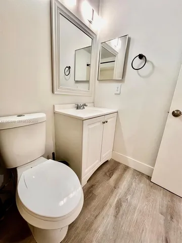 a bathroom with a toilet a sink and bathtub