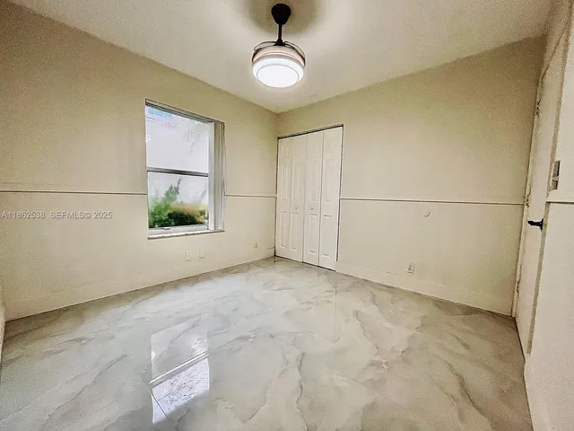 a bath tub sitting next to a white toilet