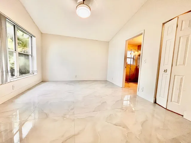 a bathroom with a double vanity sink and mirror
