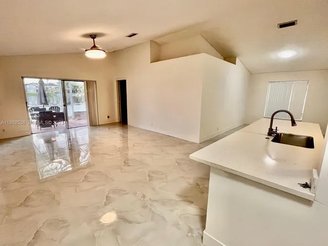 a view of a livingroom with a furniture