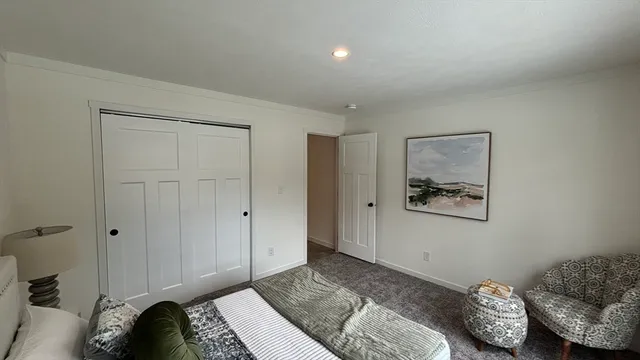 a bathroom with a toilet a sink and a window