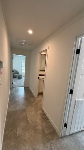 a bathroom with a sink a toilet and shower curtain