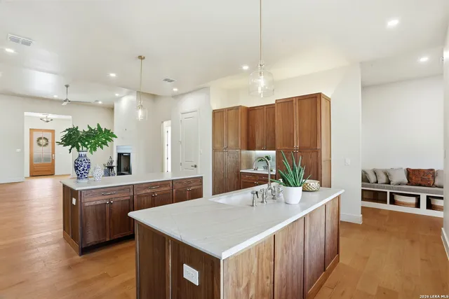 a kitchen with white cabinets