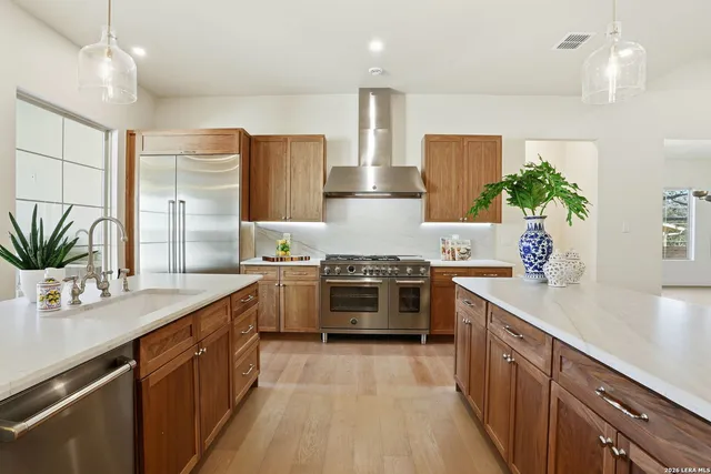 a view of balcony with chairs and potted plant